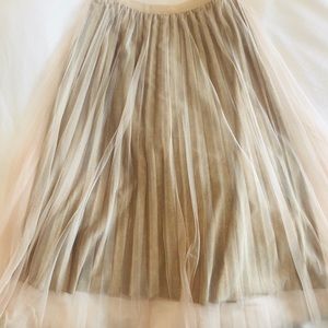 Sz Small Molly Bracken tea length skirt. Nude/silver shiny.